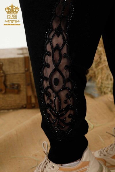 Hurtownia dresu damskiego w kolorze czarnym z tiulowymi detalami - 16562 | KAZEE - Thumbnail